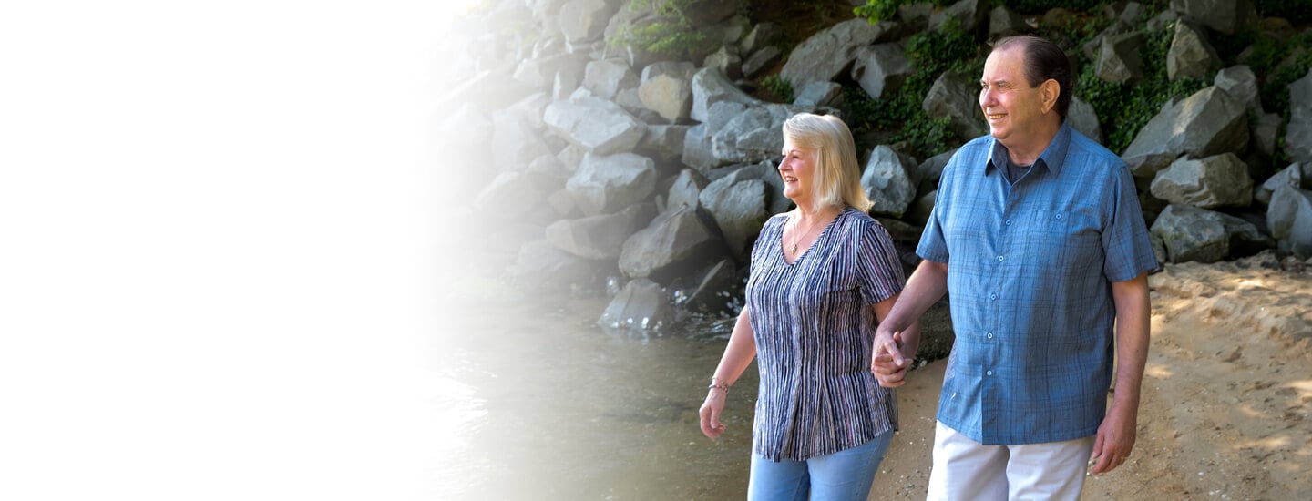 Man and woman walking happily hand in hand