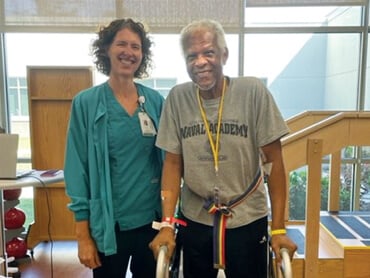 Joseph Edwards stands with his therapist.